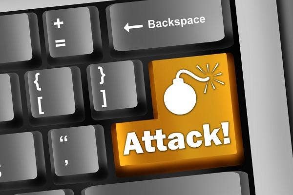 computer keyboard with attack text on enter key