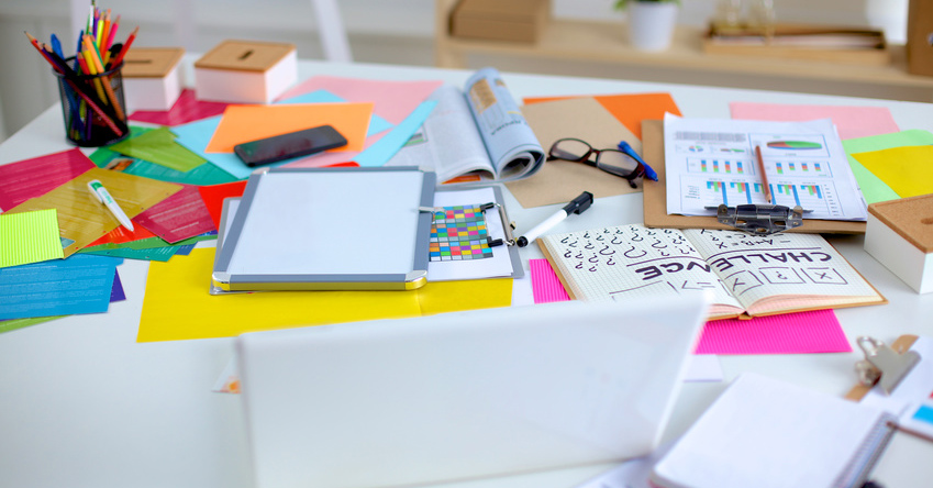 Designer&amp;#39;s table with notes and tools .