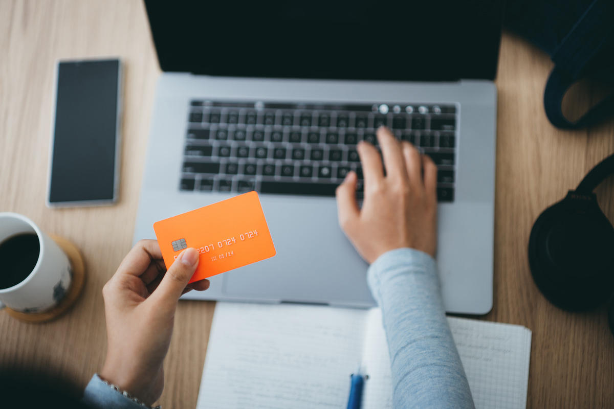 office worker with credit card in hand